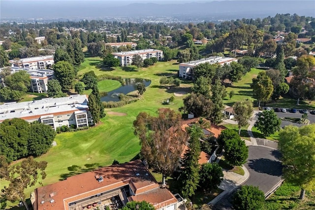 aerial view with a water view and view of golf course