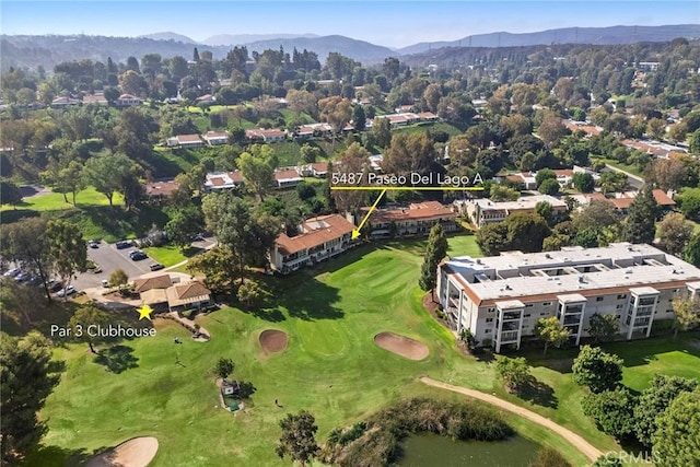 bird's eye view featuring a mountain view and view of golf course