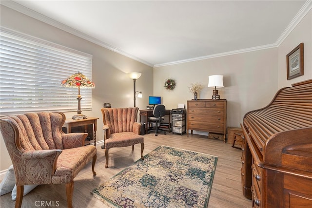 living area featuring ornamental molding and light hardwood / wood-style flooring