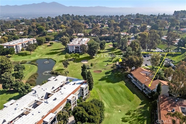 bird's eye view with a water and mountain view and golf course view