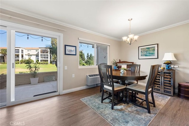 dining room featuring crown molding and wood finished floors
