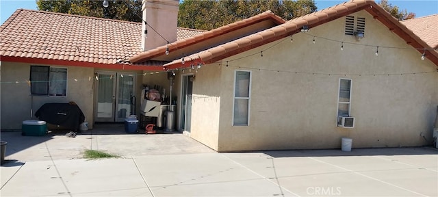 back of property featuring a patio area