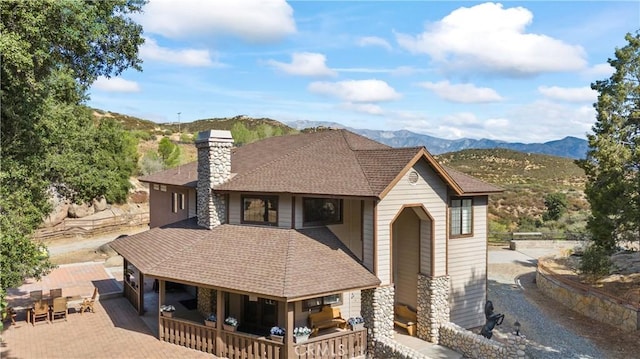 view of front of home with a mountain view