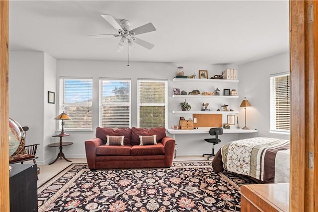 bedroom with ceiling fan and carpet floors