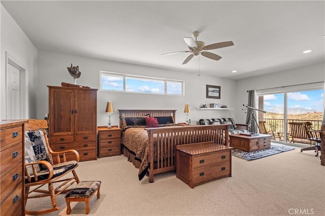 bedroom featuring access to outside, ceiling fan, and light colored carpet