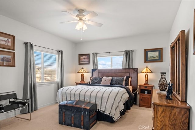 bedroom featuring light carpet and ceiling fan