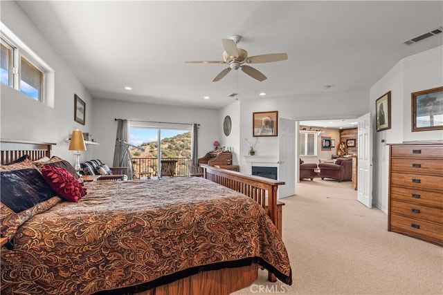 carpeted bedroom with access to exterior and ceiling fan