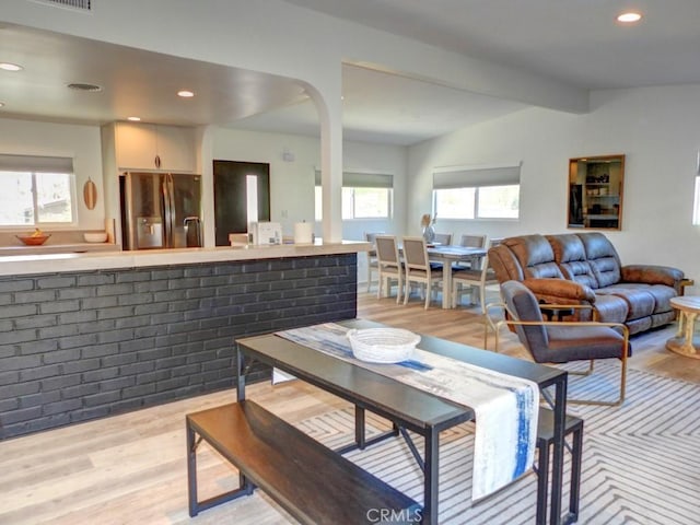 dining space with recessed lighting, visible vents, and light wood finished floors