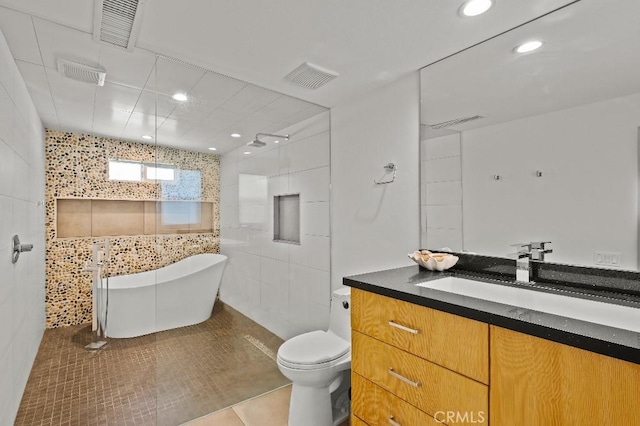 full bathroom with toilet, a soaking tub, and visible vents