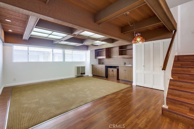 kitchen with beam ceiling, dark hardwood / wood-style floors, a wealth of natural light, and wood ceiling