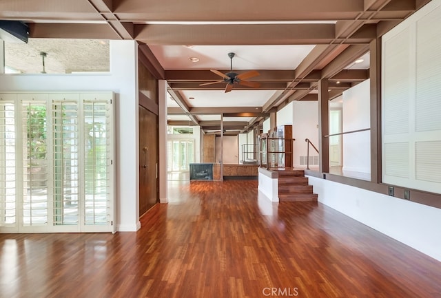 interior space with hardwood / wood-style floors, ceiling fan, beamed ceiling, and coffered ceiling