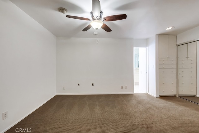 interior space with carpet flooring and ceiling fan