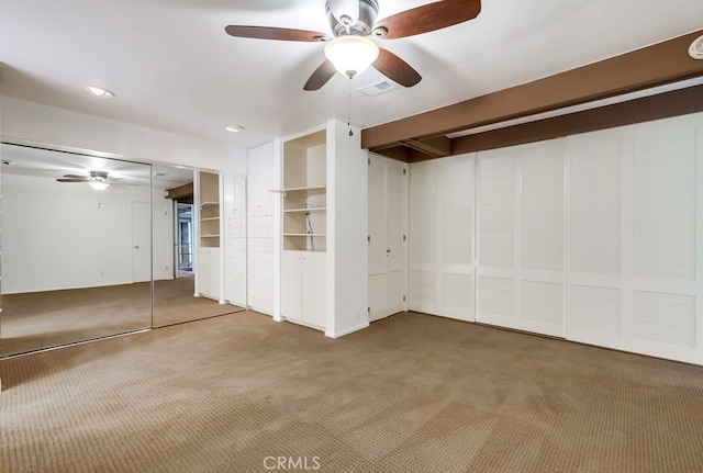 basement with carpet and ceiling fan