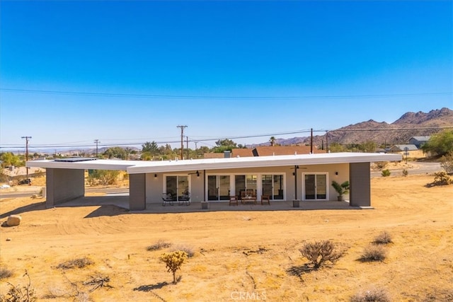 rear view of house with a mountain view