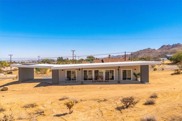 6614 Sunset Rd, Joshua Tree, CA 92252 - rear view of property with a mountain view and a carport