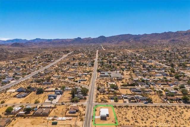 6614 Sunset Rd, Joshua Tree, CA 92252 - aerial overview of property's location with a mountain backdrop and property parcel outlined