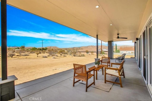 6614 Sunset Rd, Joshua Tree, CA 92252 - view of patio featuring ceiling fan and a mountain view