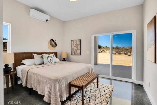 bedroom featuring a wall mounted AC and access to outside