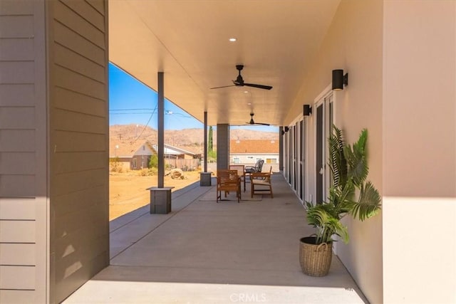 6614 Sunset Rd, Joshua Tree, CA 92252 - view of patio / terrace with a ceiling fan, outdoor dining space, and a mountain view
