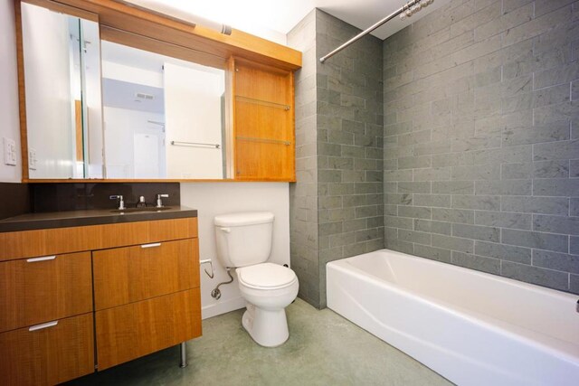 full bathroom with toilet, vanity, shower / bathing tub combination, and concrete flooring