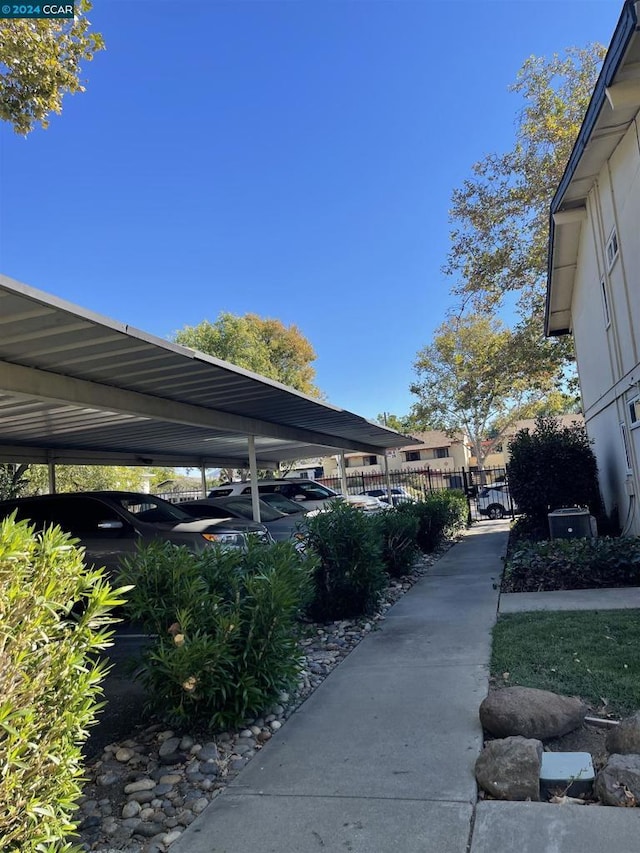 view of vehicle parking with a carport