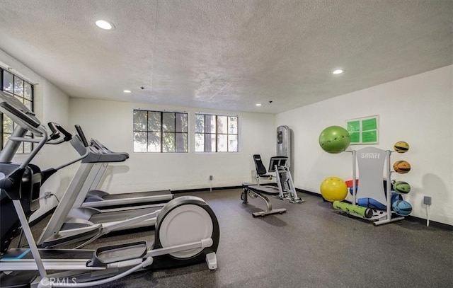 workout area with a textured ceiling