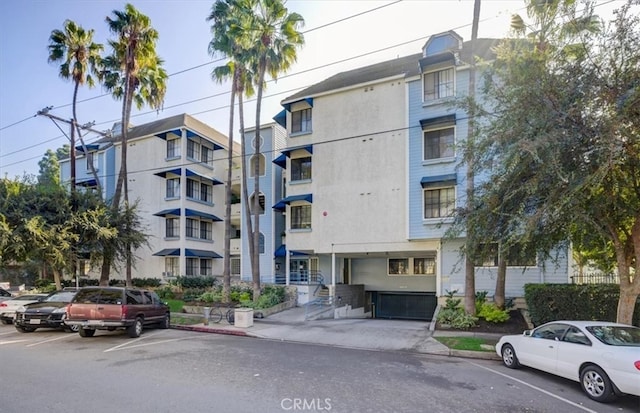view of property featuring uncovered parking