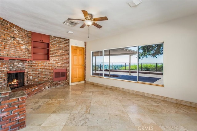 unfurnished living room with a brick fireplace and ceiling fan