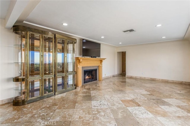 unfurnished living room with ornamental molding