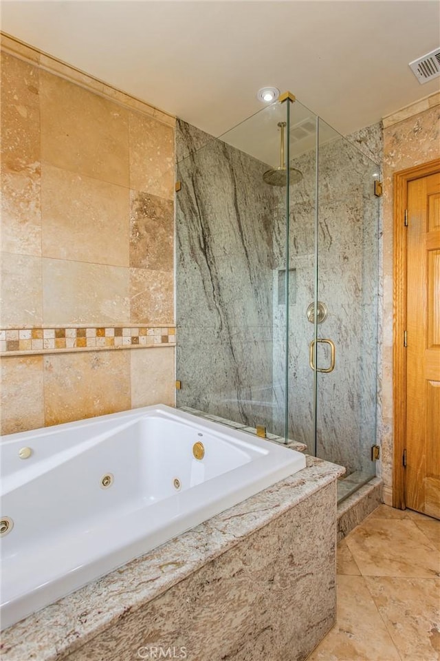 bathroom with independent shower and bath and tile walls