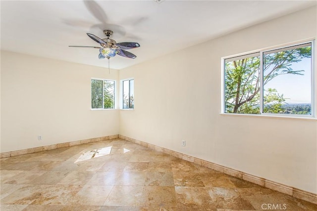 unfurnished room featuring ceiling fan