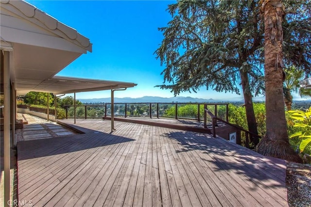 wooden terrace with a mountain view