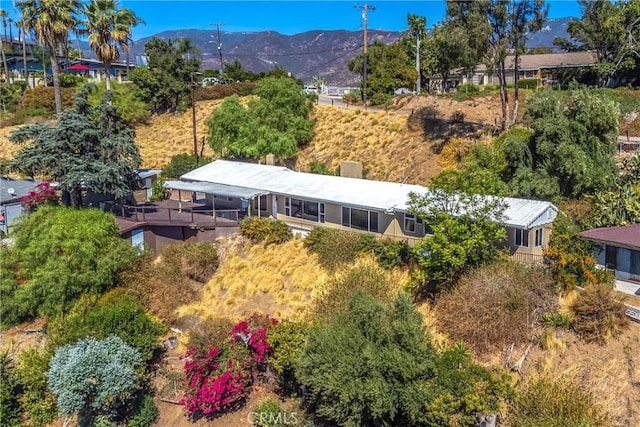 birds eye view of property featuring a mountain view