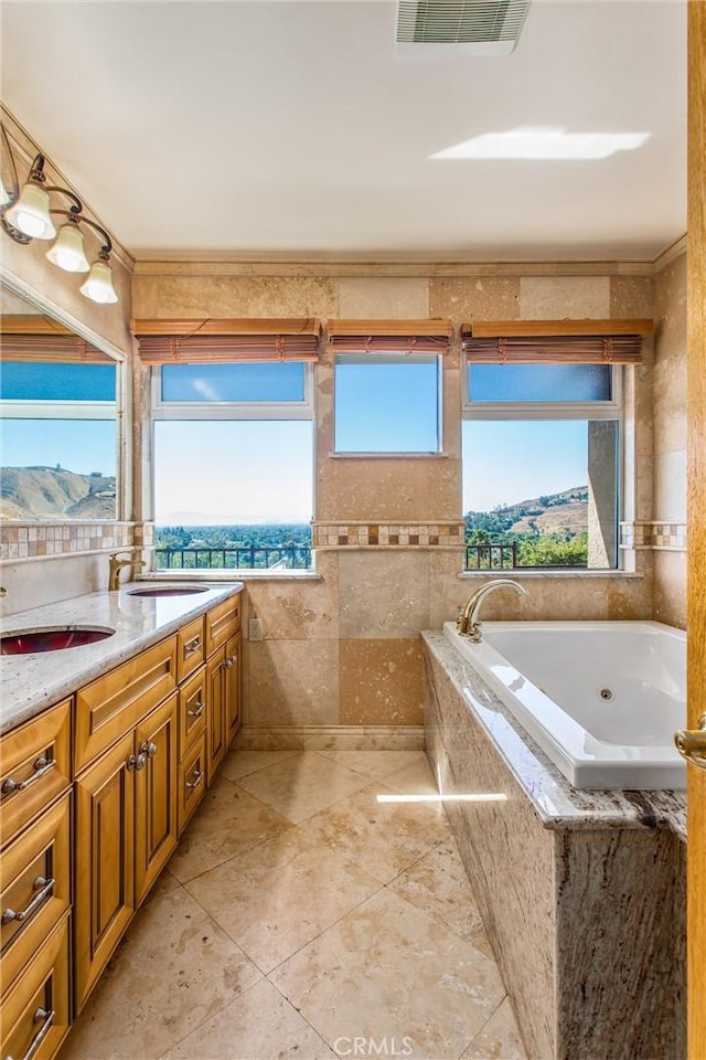 bathroom featuring plenty of natural light, a mountain view, and vanity