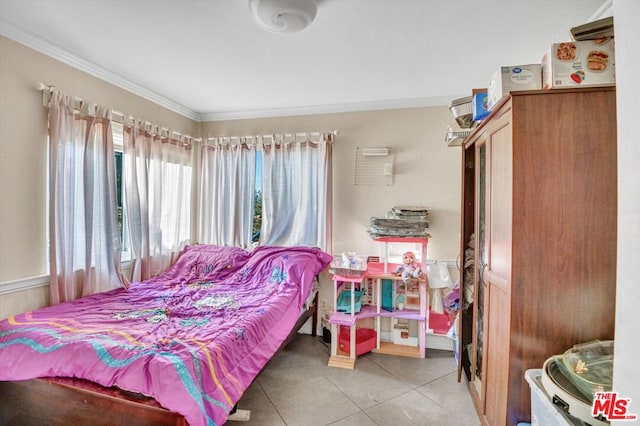 bedroom with light tile patterned floors and ornamental molding