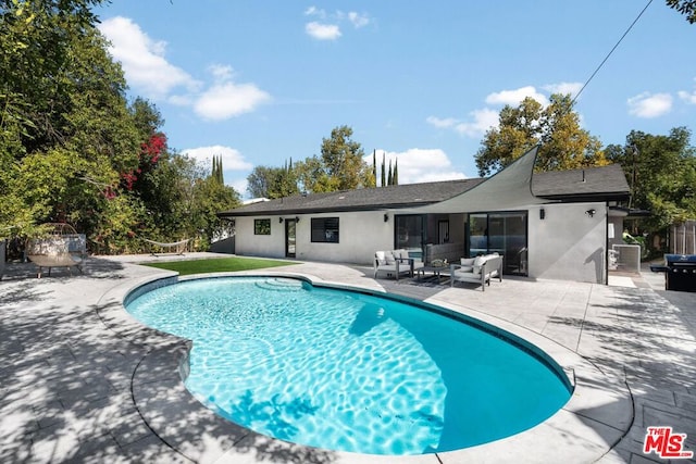 view of pool featuring an outdoor hangout area and a patio area