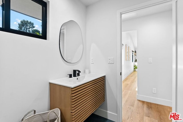 bathroom featuring vanity and hardwood / wood-style flooring