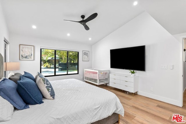 bedroom with wood-type flooring, lofted ceiling, and ceiling fan