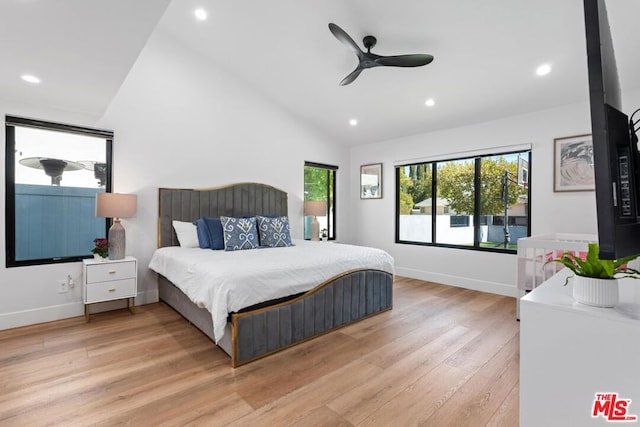 bedroom with high vaulted ceiling, light hardwood / wood-style flooring, and ceiling fan