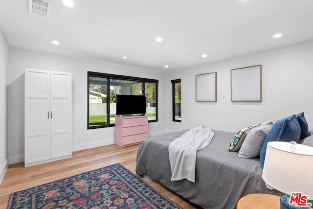 bedroom with light hardwood / wood-style flooring