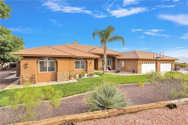 view of front of property with a garage and a front yard