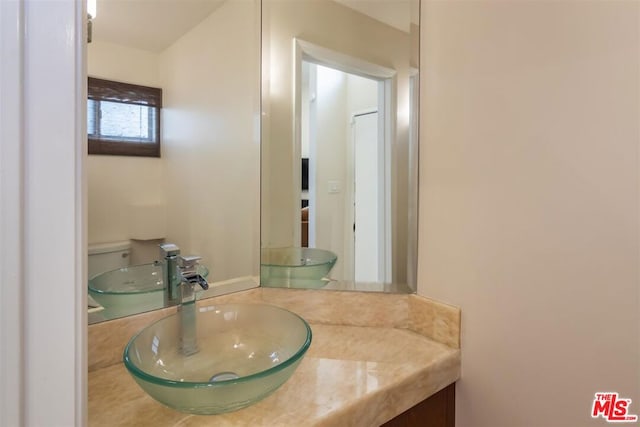 bathroom with vanity and toilet