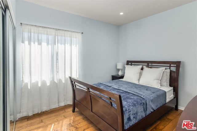 bedroom with hardwood / wood-style flooring