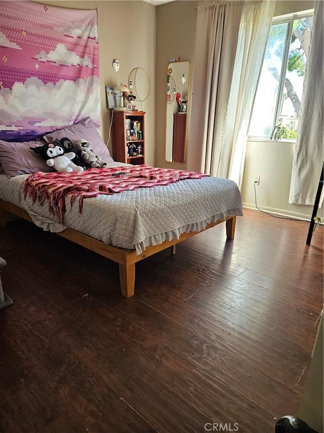 bedroom with wood-type flooring