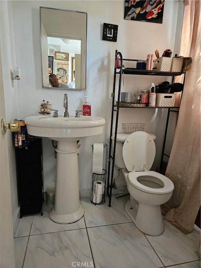 bathroom featuring toilet