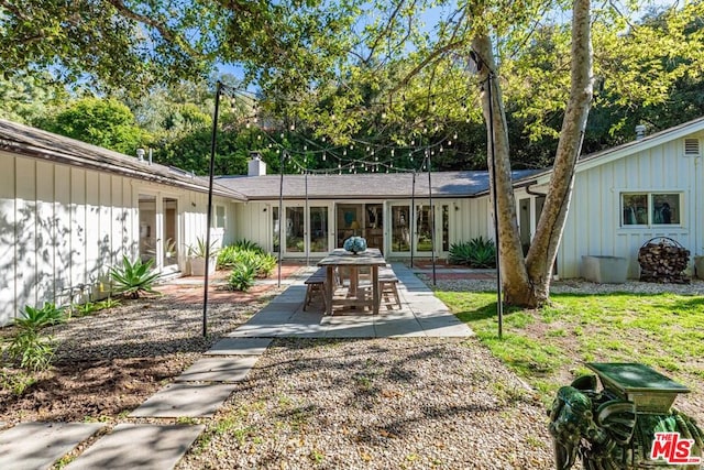 rear view of property with a patio area