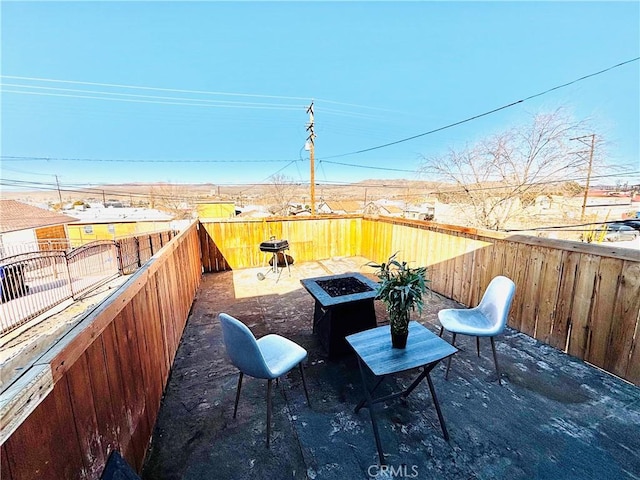 view of patio / terrace with a fire pit