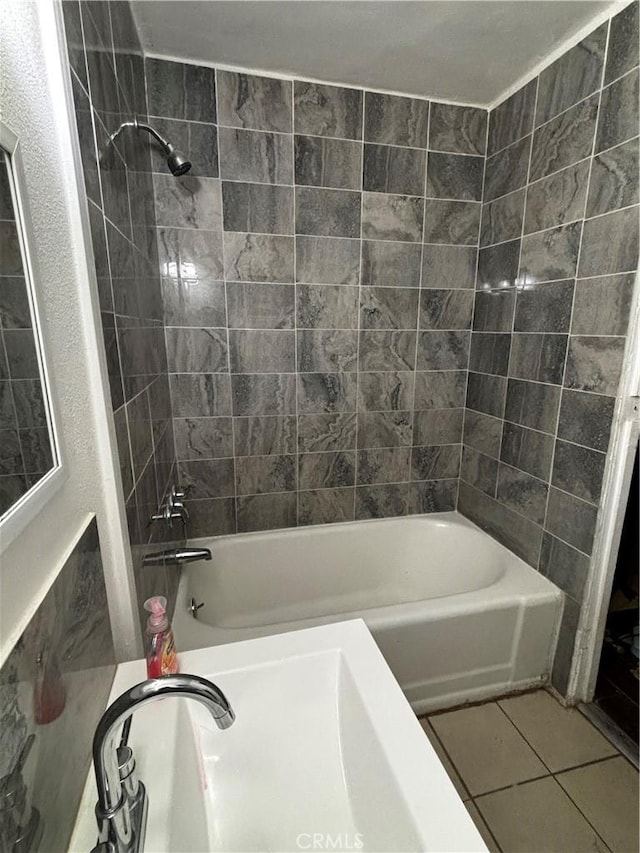 bathroom with tile patterned floors and tiled shower / bath combo