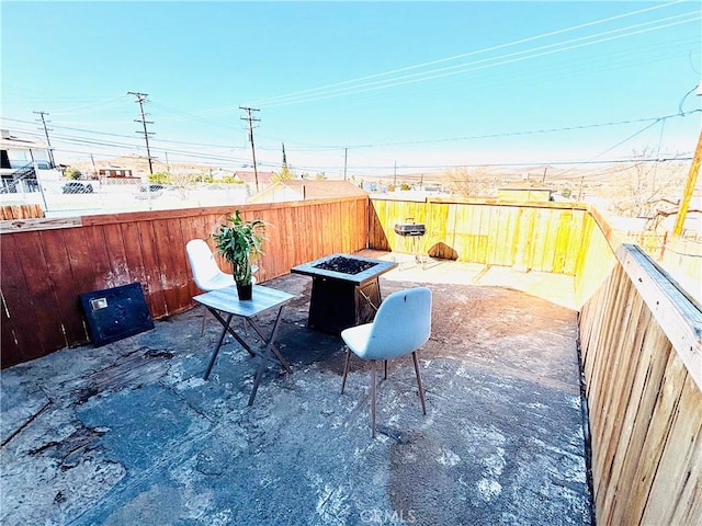 view of patio / terrace with a fire pit