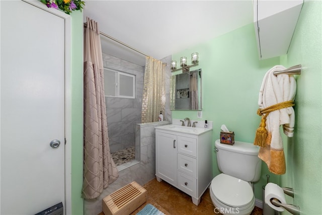 bathroom featuring toilet, curtained shower, vanity, and tile patterned flooring